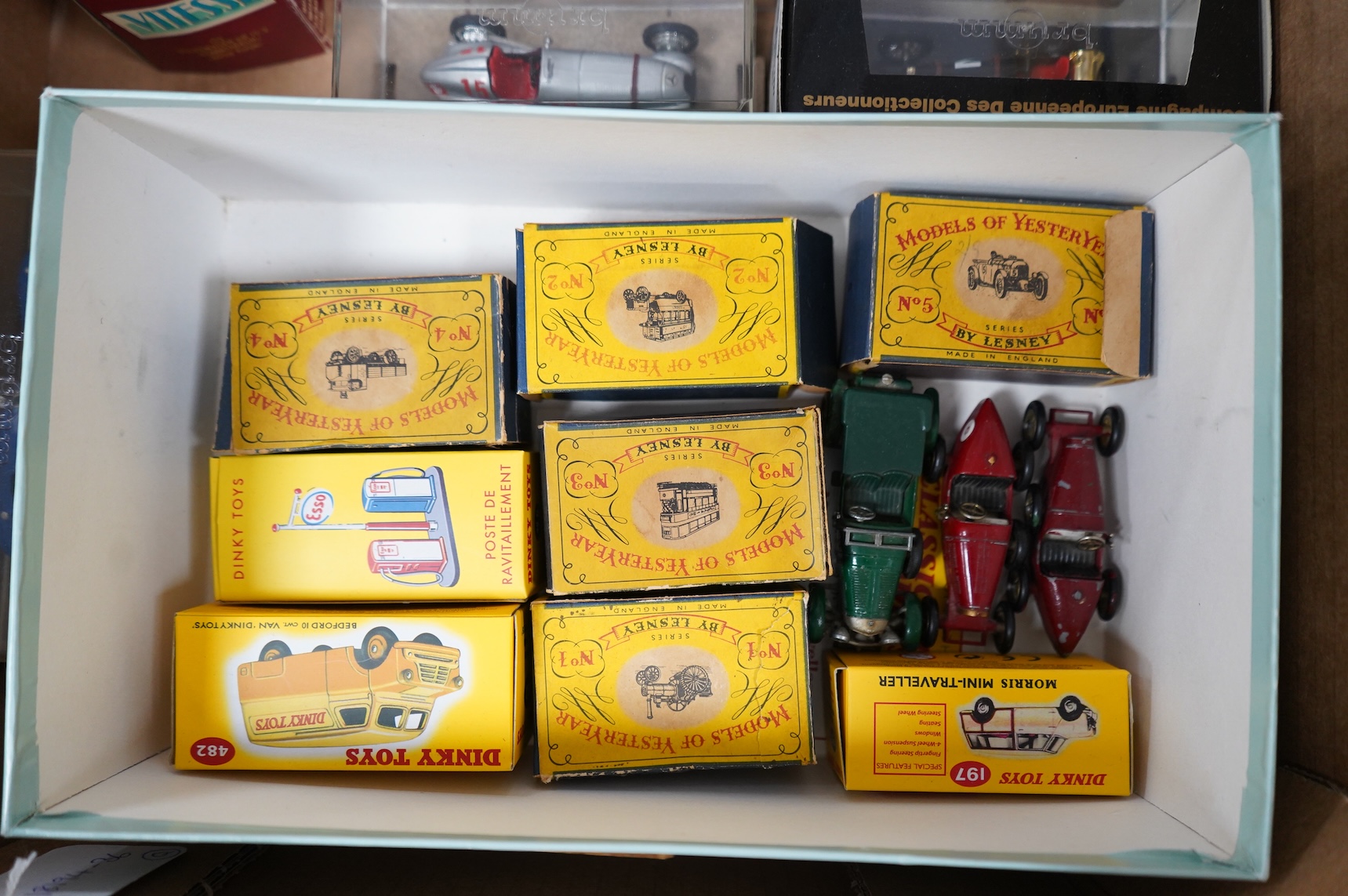 A collection of diecast vehicles, including a boxed CMC 1:18 scale Mercedes Benz W196 1950s single seat racing car, together with five boxed early Matchbox Models of Yesteryear, two Atlas Dinkies, a 1:18 scale Bburago Bu